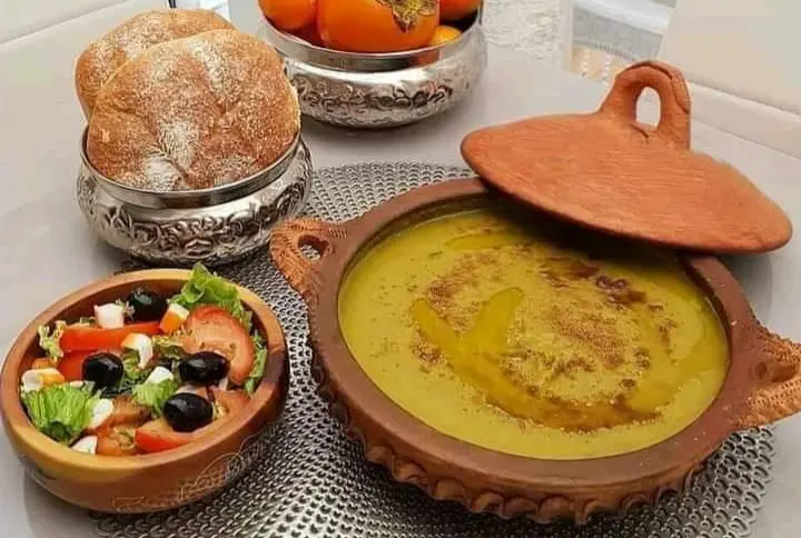 Warm Moroccan Bissara soup drizzled with extra virgin olive oil and cumin